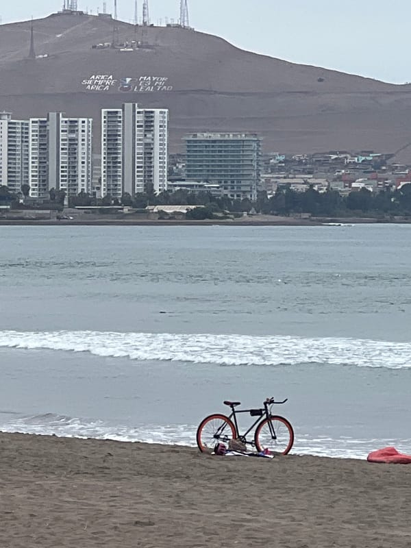 Afternoon beach scene documented at Arica, Chile waterfront establishments