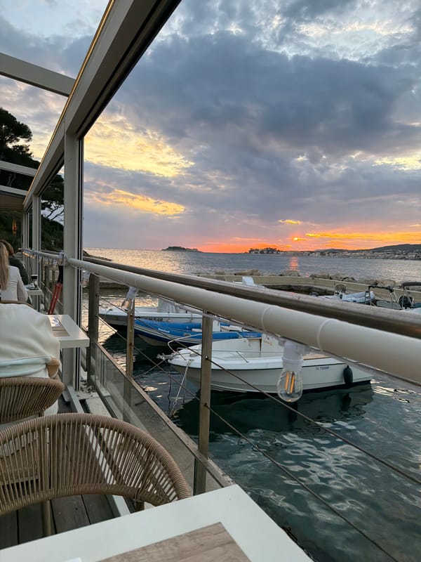 Sunset observed over Sanary-sur-Mer marina from waterfront location