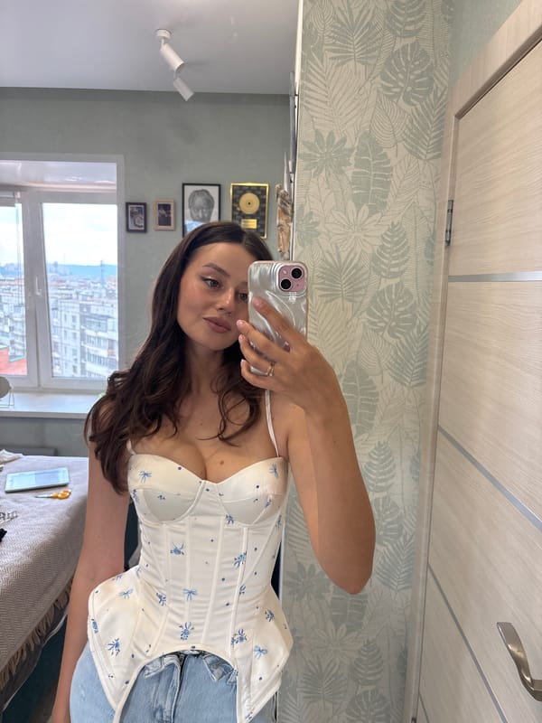 Woman takes selfies in room and car in Krasnoyarsk