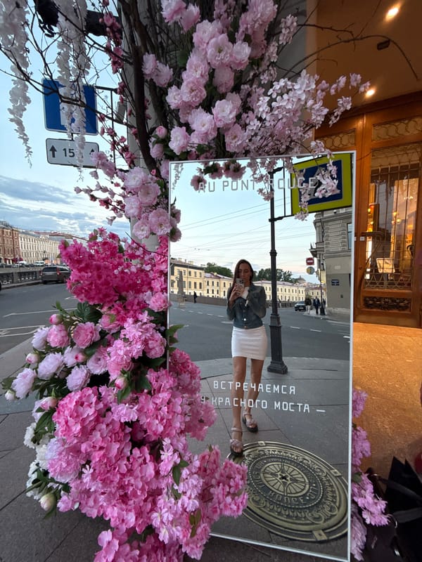 Evening street life documented across central Saint Petersburg landmarks