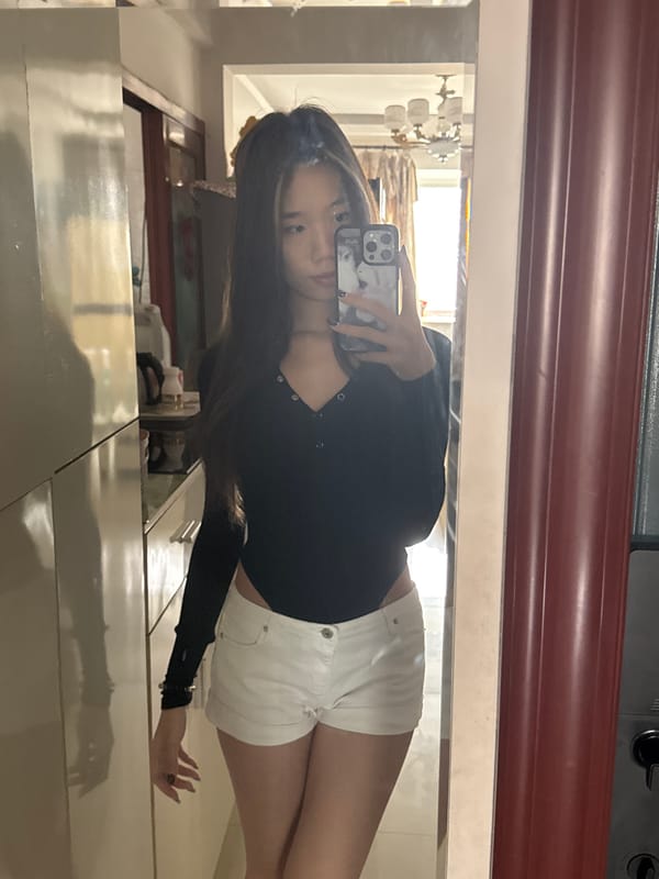 Woman takes multiple selfies in decorated bedroom during early morning