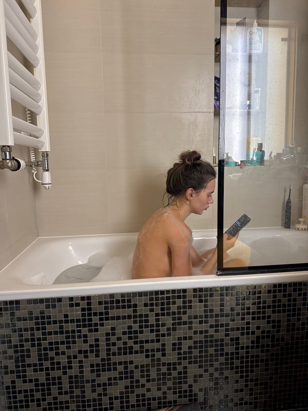 Woman photographs Easter cakes and eggs in Warsaw kitchen