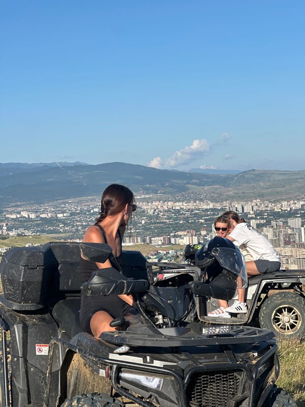 ATV ride on Tbilisi hillside with city and mountain views