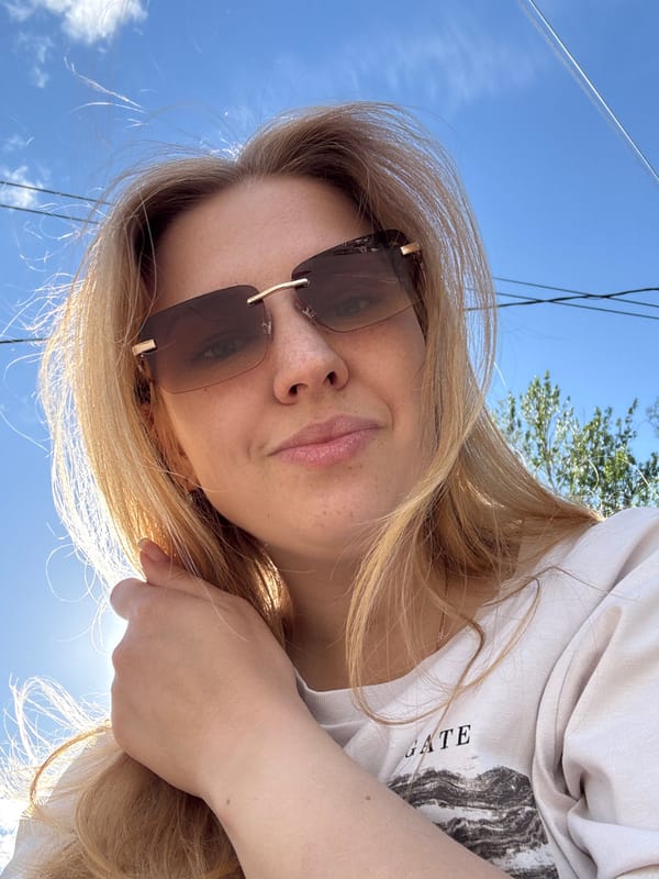 Woman photographed in upward-angle shots in Rusanovo, Russia