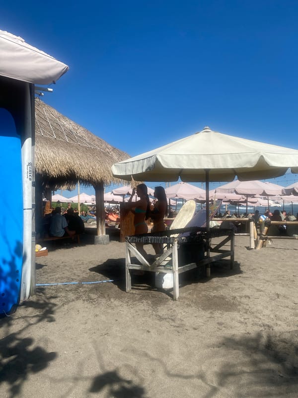 Relaxed beach club morning on North Kuta's black sand shore