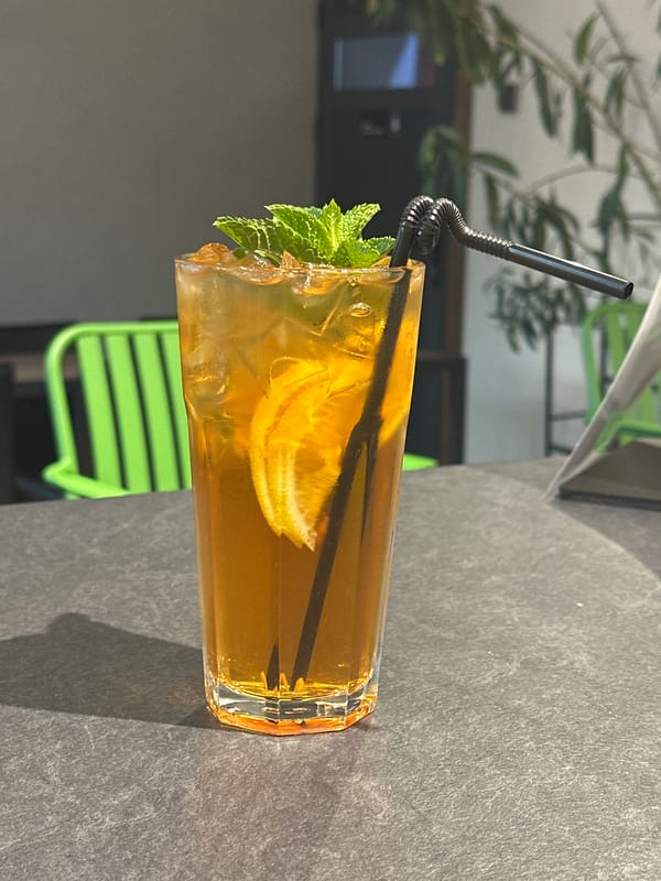 Inside a Bishkek café: drinks, coffee gear, and ambiance