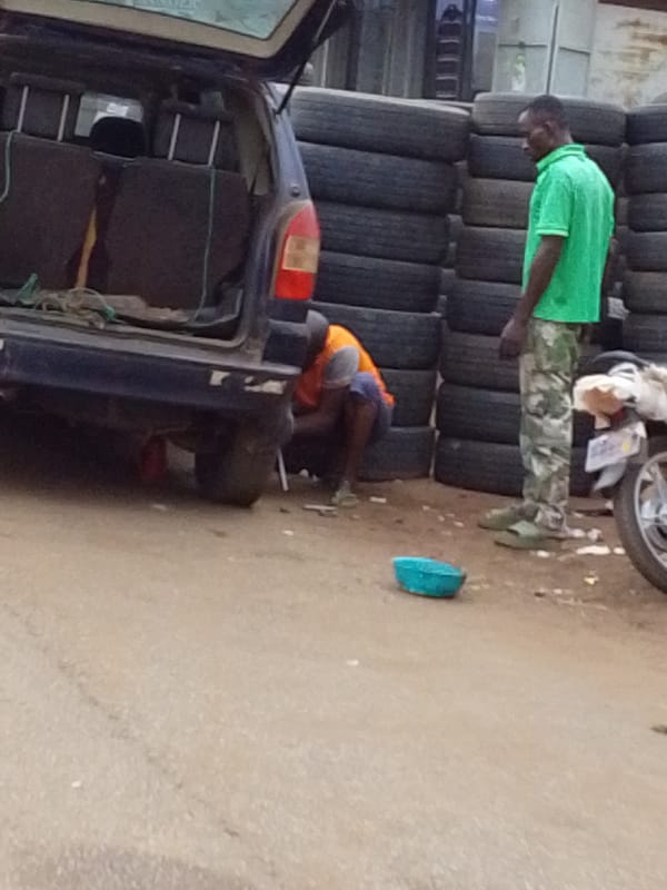 Street scenes show tire repair, motorcyclists in Tamale Ghana