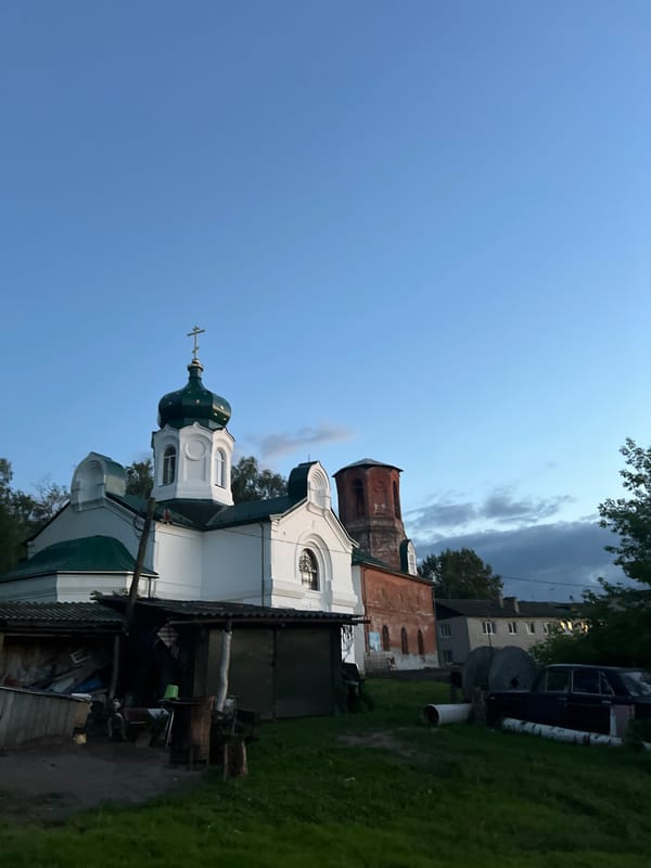 Dusk settles over a quiet rural yard in Afanasyevo