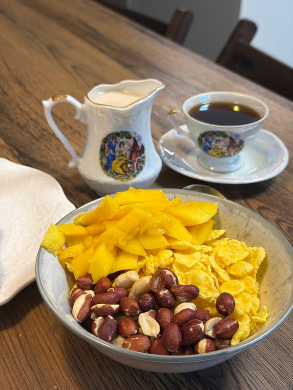 Breakfast spread with cereal, mango, and egg toast in Perm