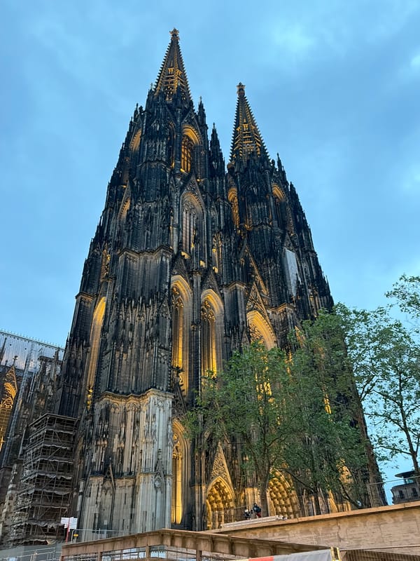 Evening visitors capture Cologne Cathedral's illuminated Gothic architecture