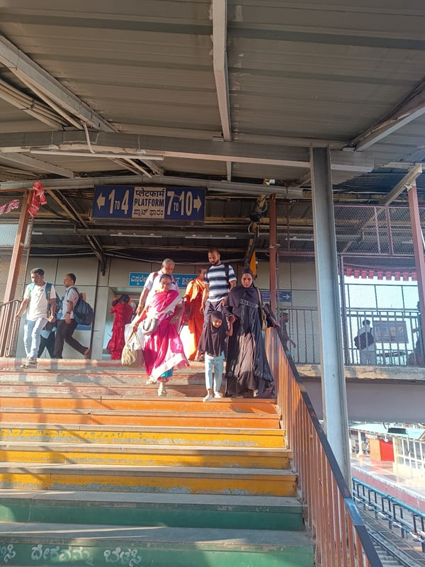 Morning commuters use pedestrian bridge at Bengaluru train station