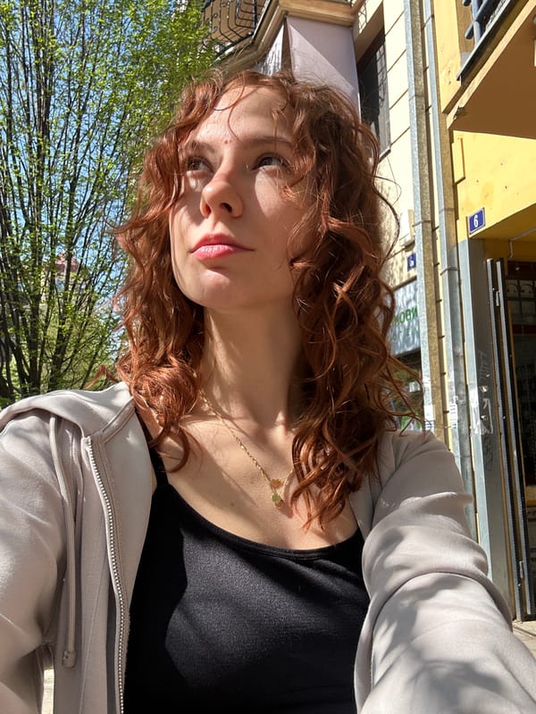 Woman enjoys outdoor pastry break in sunny Novi Sad