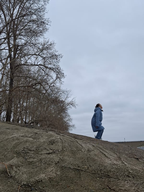 Young woman poses for outdoor photo session in Chaikovsky