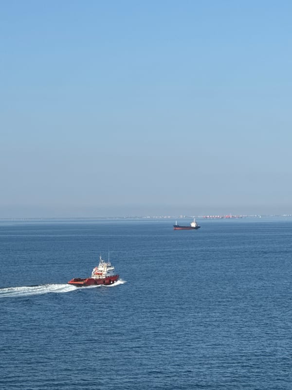 Tugboats working around an offshore oil rig in the Adriatic