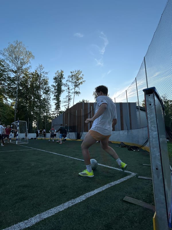 Pickup soccer on a turf field decorated with Russian flag colors