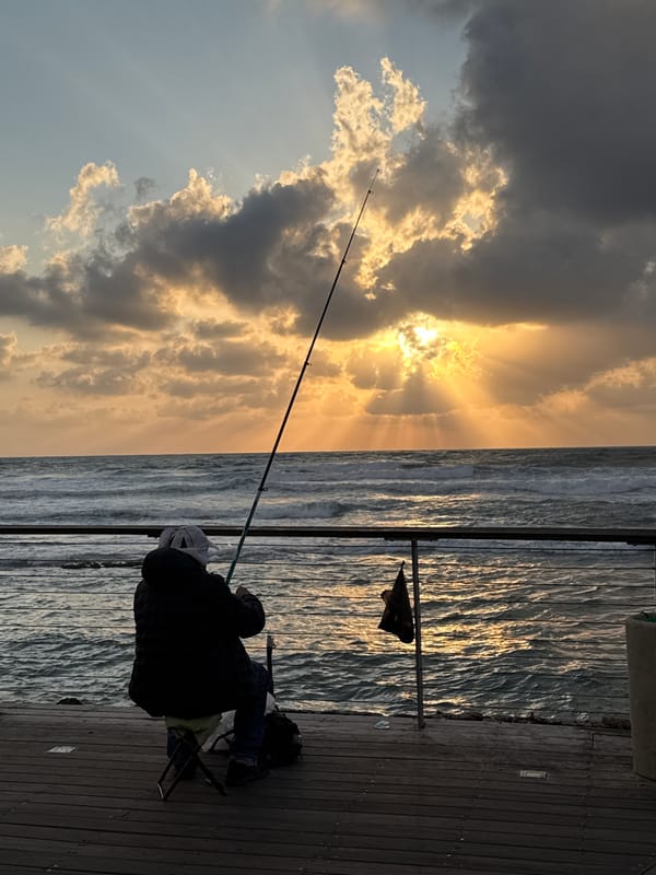 Sunset fishing observed on Tel Aviv pier