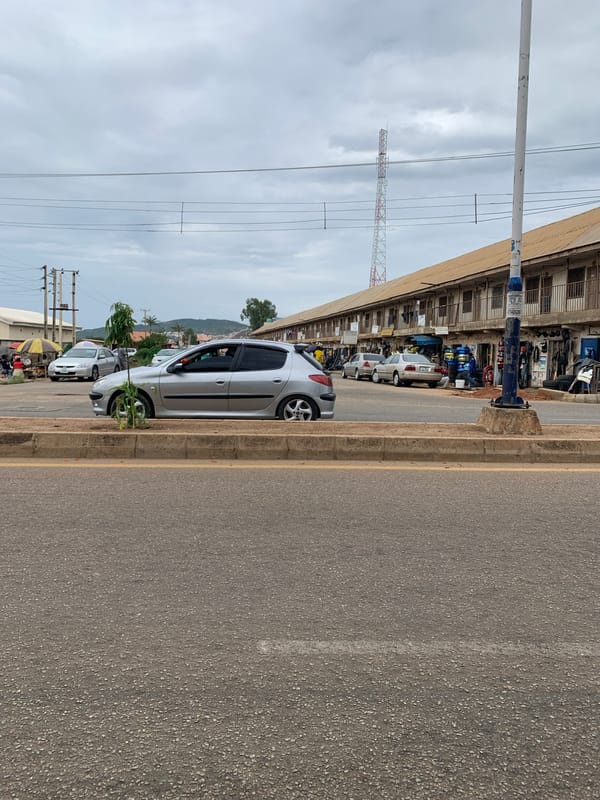 Overcast afternoon street scene documented in New Stadium, Nigeria