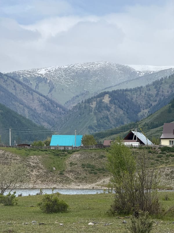 Mountain slope photographed through clouds in Ust-Koksa, Russia