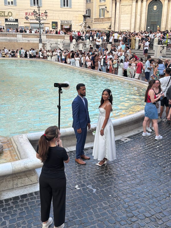 Crowds and couples at Rome's Trevi Fountain
