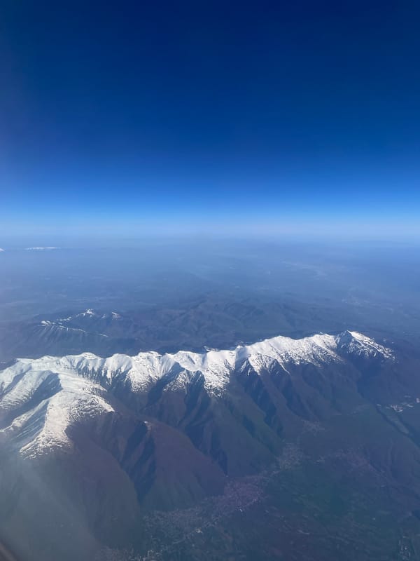 Morning aerial views capture Montenegro's snow-capped mountains and coastline