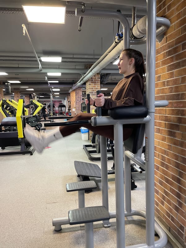 Woman conducts early morning workout session at Izhevsk gym