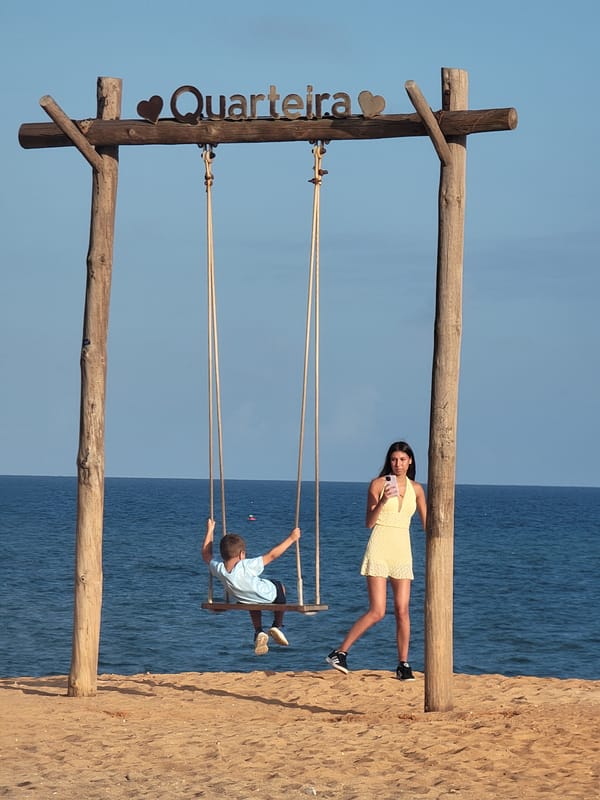 Afternoon beach hangout at Quarteira's shoreline, Portugal