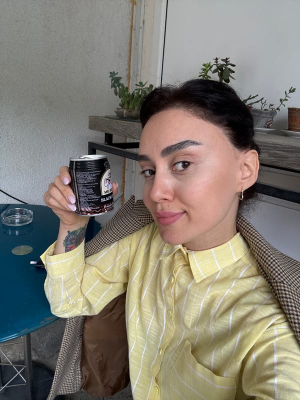 Woman enjoys morning coffee at Tbilisi cafe