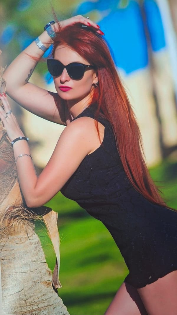 Woman photographed with jewelry collection in Belarus village