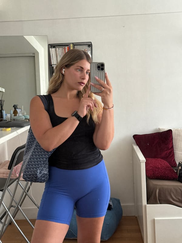 Woman takes selfies in mirror at Paris residence