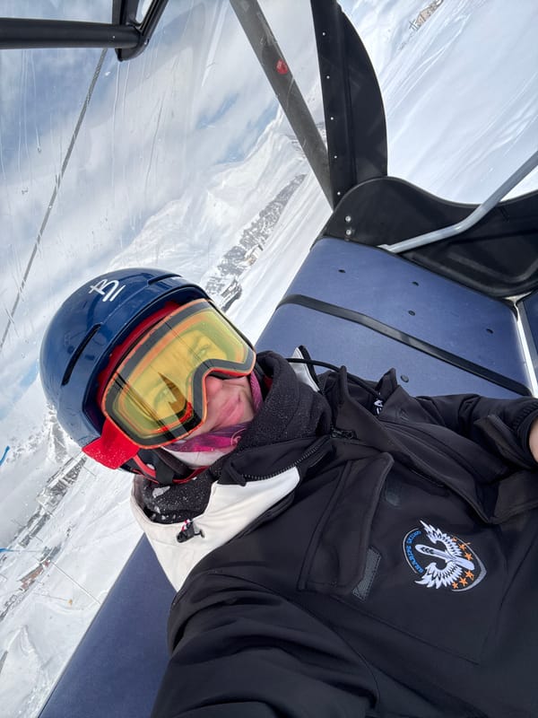 Winter sports enthusiasts ride chairlift at Georgian ski resort