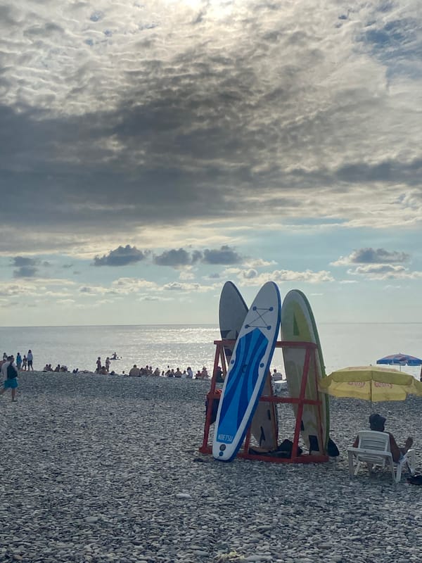 Batumi's pebble beach and rising skyline, summer 2026