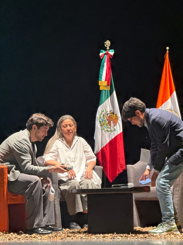 Man adjusts green patio umbrella in San Andrés Cholula