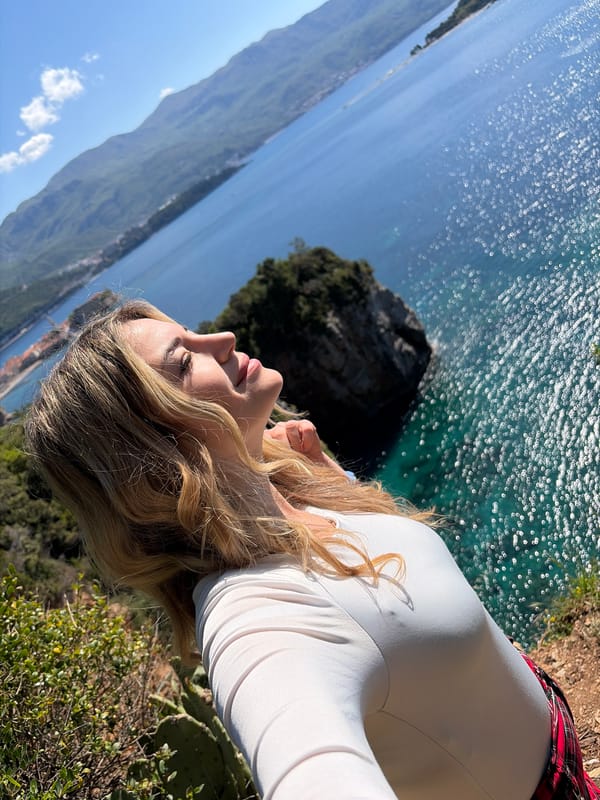 Tourists capture scenic moments at Budva cliffs and coastline
