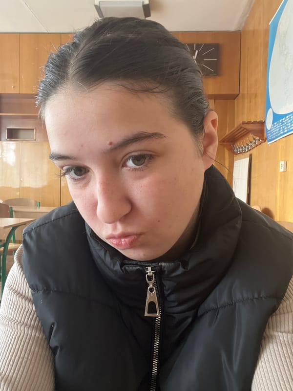 Woman photographed in Ukrainian classroom during morning hours