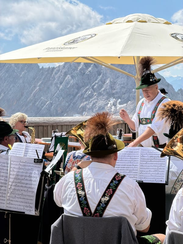 Brass band plays traditional set at Alpine outdoor venue, Austria