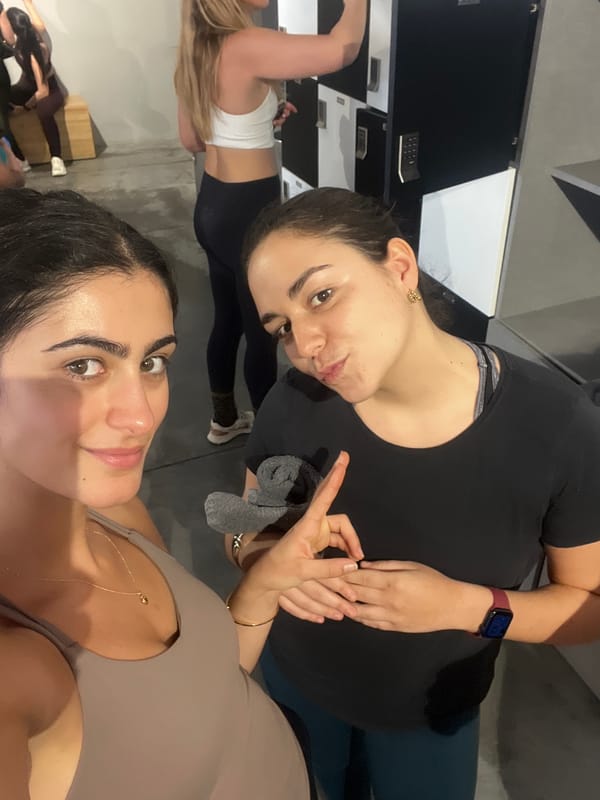 Women take selfies in Paris commercial establishment