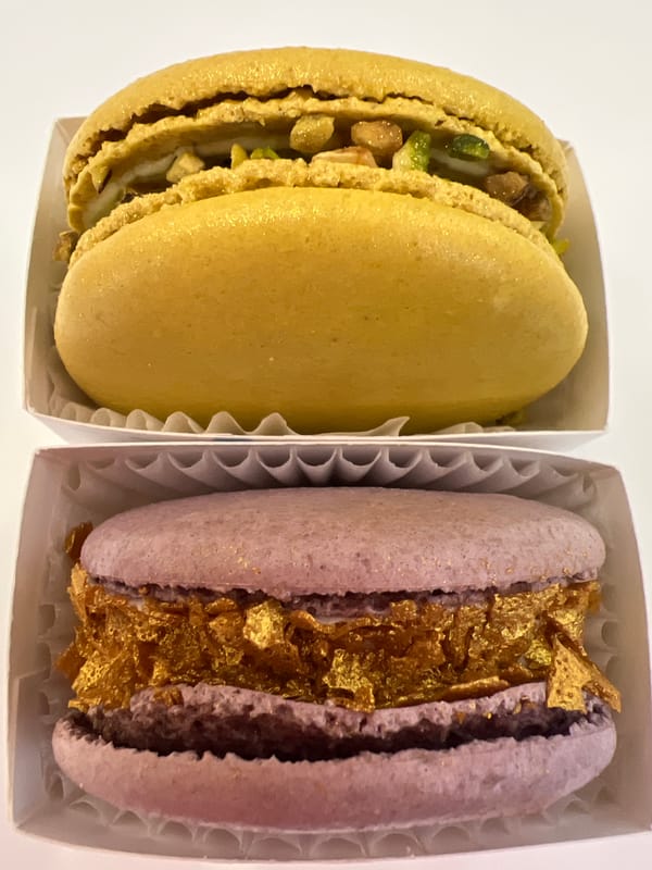 Stacked macarons in paper cups, spotted outdoors in Russia