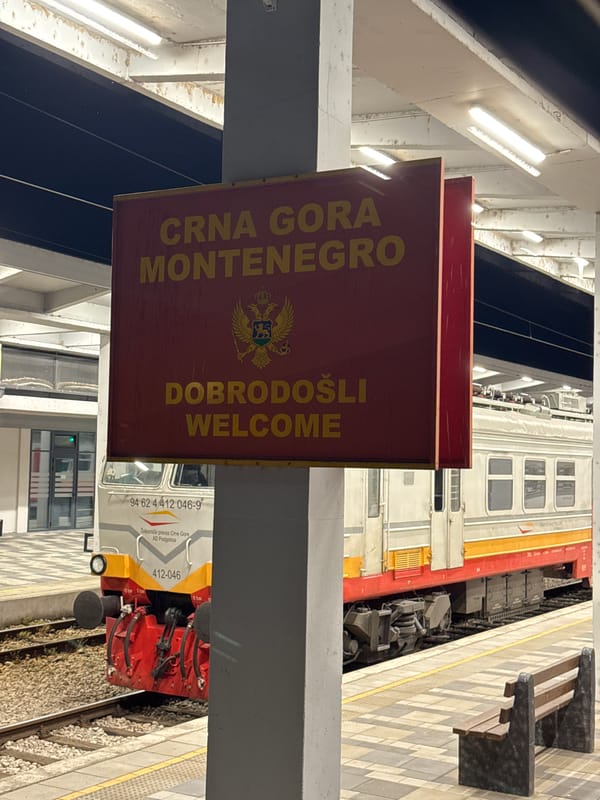Srbija Voz train at Montenegro's Nedakusi station after dark