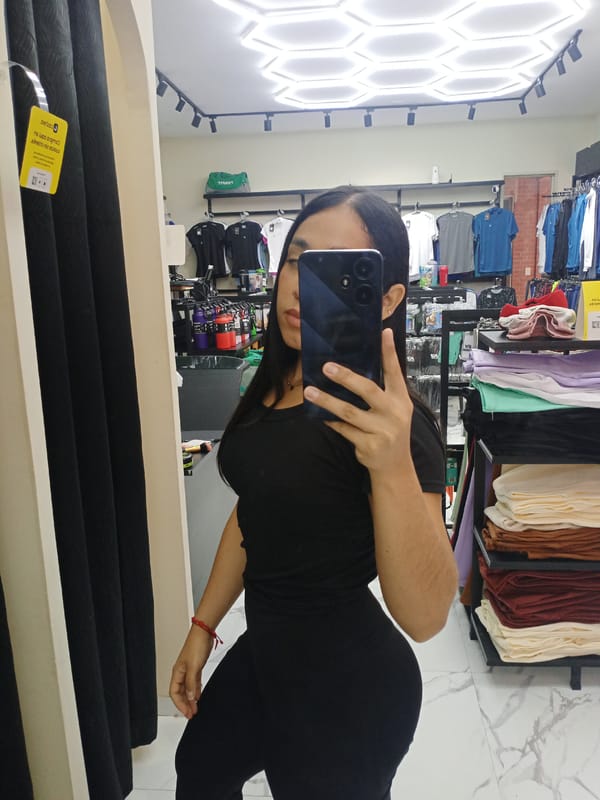 Shopper takes selfies during clothing store visit in Venezuela