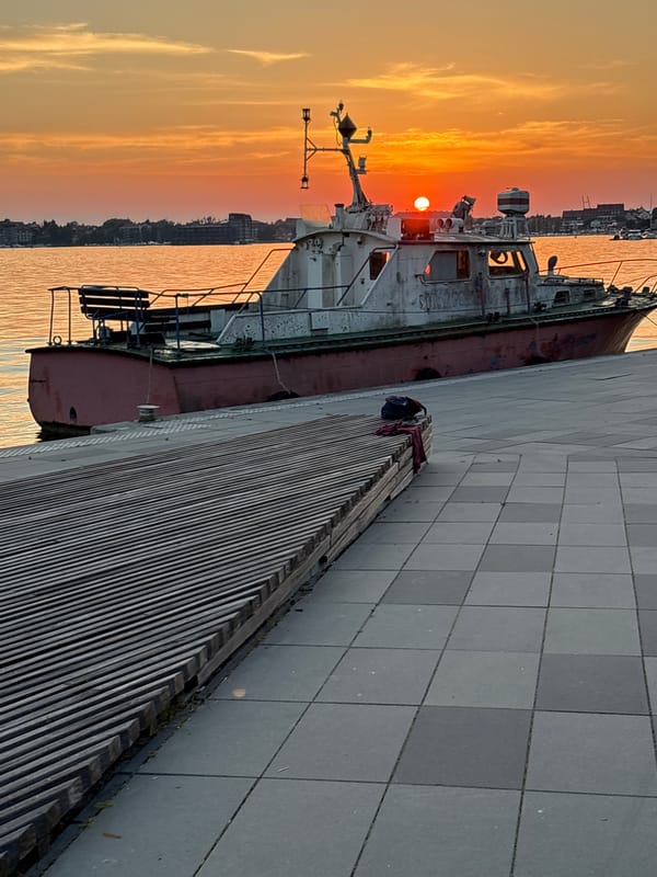 Golden hour on the Mikołajki waterfront, summer evening.