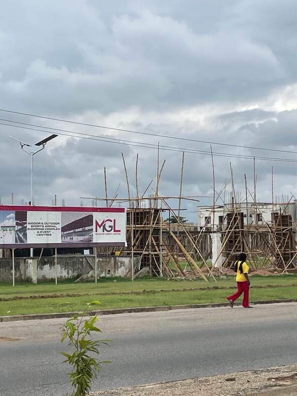 Quiet roadside scene in Jalingo under cloudy skies
