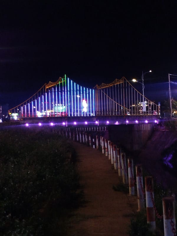 Illuminated bridge with colorful lights observed in Vietnam