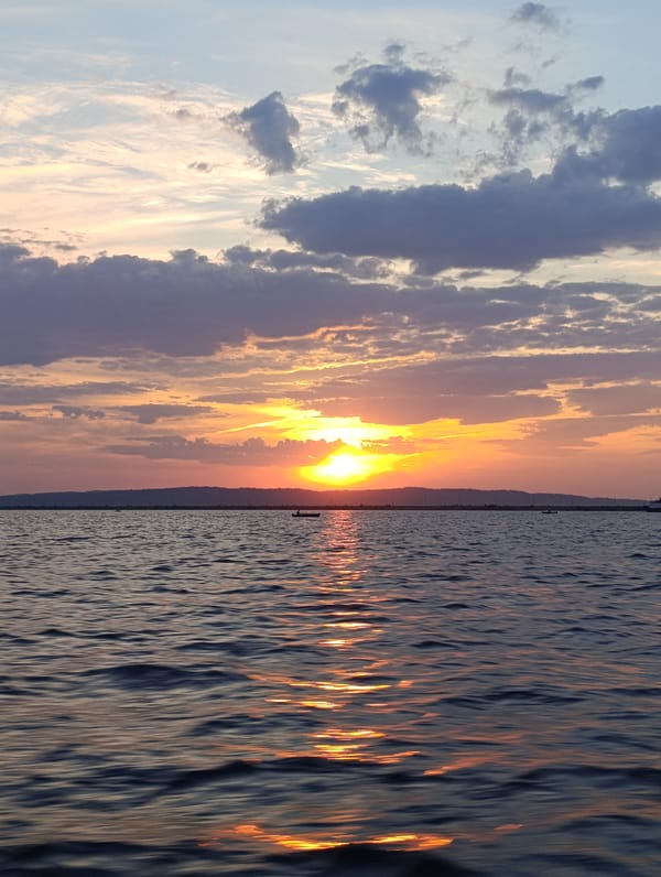 Sunset on the Kama River, boats and barges at dusk