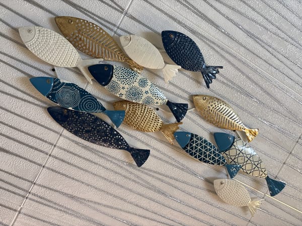 Decorative ceramic and metal fish on display in Tsarevo