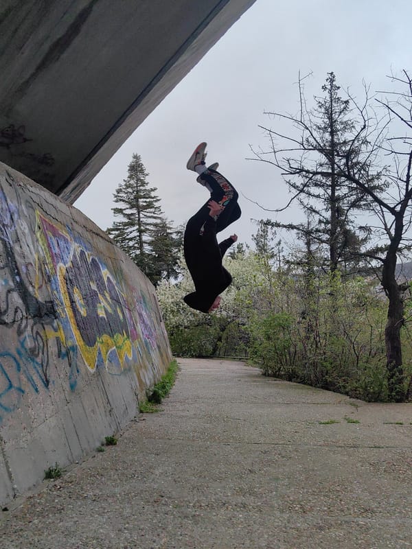 Person performs early morning backflip on Varna walkway