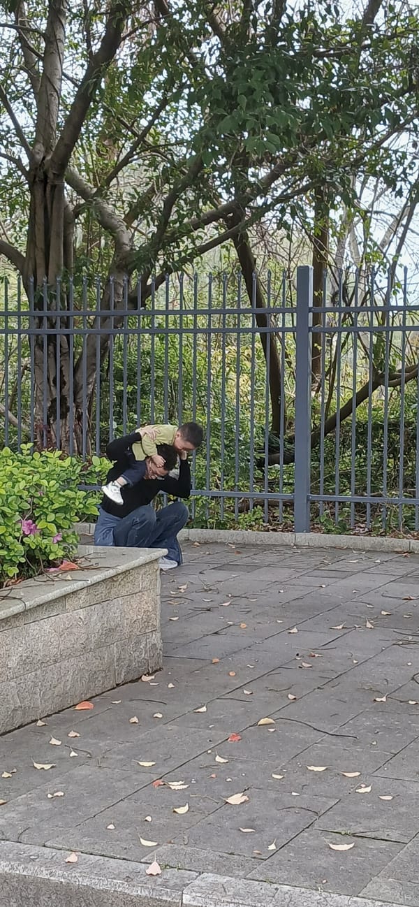 Father and child photographed together in Chongqing tech district