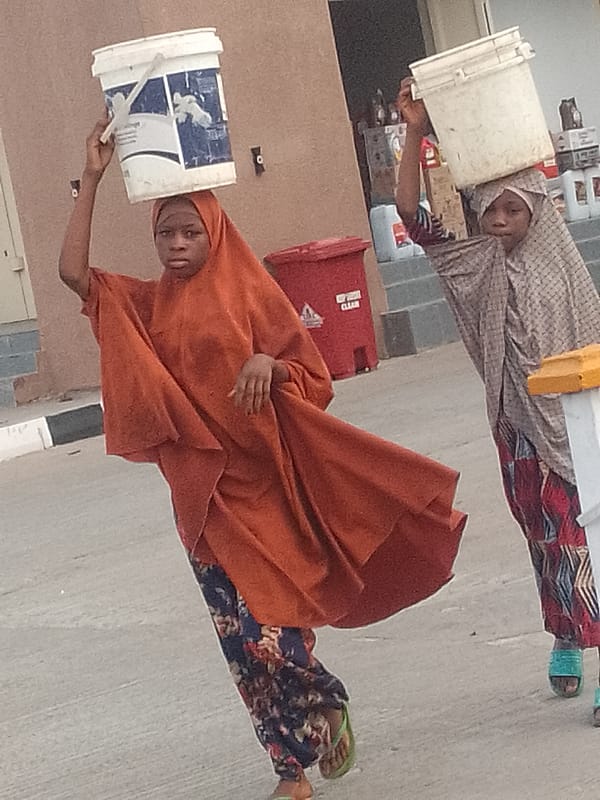 Morning foot traffic on a Pantame, Nigeria street