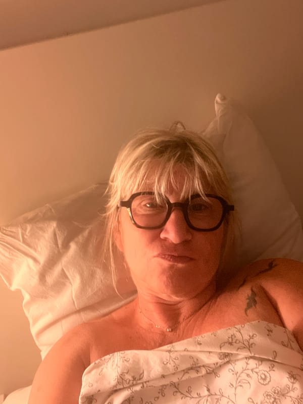 Resting in a floral-sheeted bed in Chambœuf