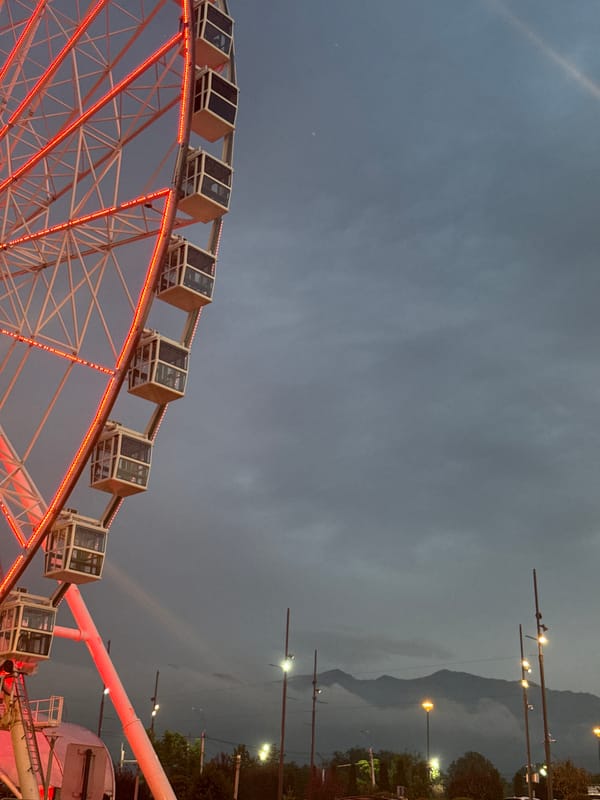 Evening around Almaty's Ferris wheel, mall, and restaurants