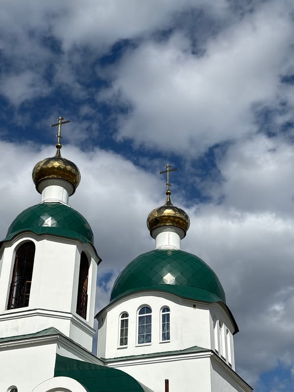 Tourist visits Orthodox church in rural Russian village